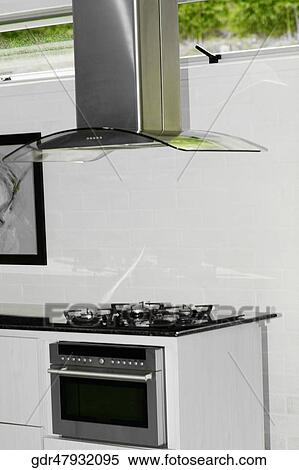 Stock Photography - Kitchen exhaust over a stove. Fotosearch