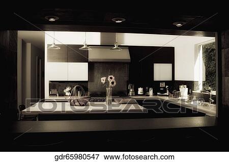 Kitchen viewed through a window View Large Photo Image Stock Photo - Kitchen viewed through a window. Fotosearch