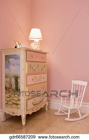 Lamp lit up on a sideboard View Large Photo Image Stock Photo - Lamp lit up on a sideboard. Fotosearch