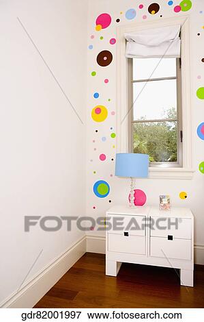 Lamp on a night table in the bedroom View Large Photo Image Stock Photo - Lamp on a night table in the bedroom. Fotosearch