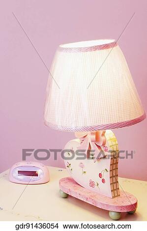 Lamp on a night table View Large Photo Image Picture - Lamp on a night table. Fotosearch