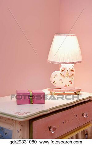 Lamp with a box on a sideboard View Large Photo Image Stock Image - Lamp with a box on a sideboard. Fotosearch