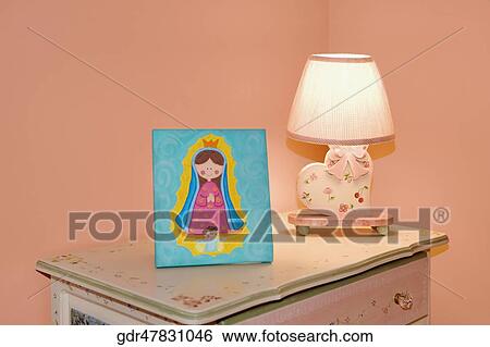 Lamp with a picture frame on a sideboard View Large Photo Image Stock Photograph - Lamp with a picture frame on a sideboard. Fotosearch