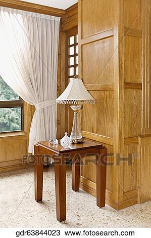 Stock Image - Lampshade on a stool. Fotosearch