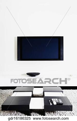 LCD television mounted on a wall View Large Photo Image Stock Photography - LCD television mounted on a wall. Fotosearch
