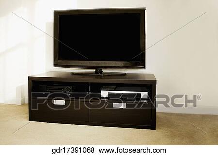 Stock Photo - LCD television on a table. Fotosearch