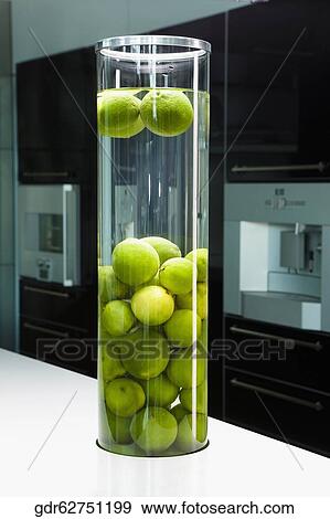 Lemons in a jar on a kitchen counter View Large Photo Image Stock Photo - Lemons in a jar on a kitchen counter. Fotosearch