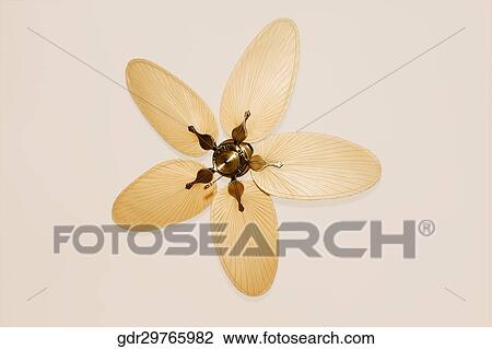 Low angle view of a ceiling fan View Large Photo Image Stock Image - Low angle view of a ceiling fan. Fotosearch