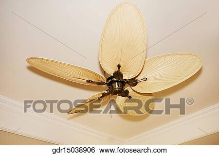 Stock Photograph - Low angle view of a ceiling fan. Fotosearch
