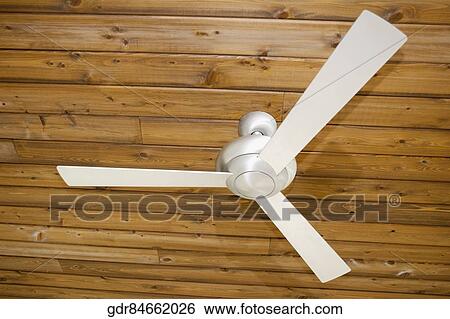 Low angle view of a ceiling fan View Large Photo Image Stock Photograph - Low angle view of a ceiling fan. Fotosearch