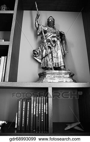 Low angle view of a statue in a shelf View Large Photo Image Stock Photo - Low angle view of a statue in a shelf. Fotosearch