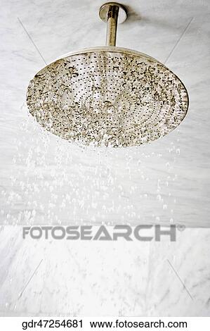 Low angle view of water dripping from a shower head View Large Photo Image Stock Image - Low angle view of water dripping from a shower head. Fotosearch