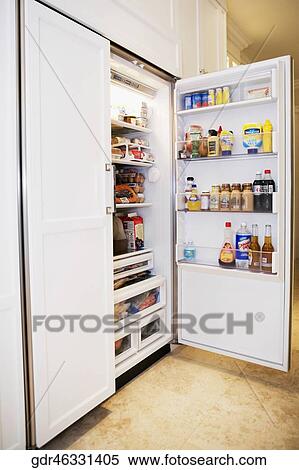 Stock Photography - Open refrigerator in a kitchen. Fotosearch