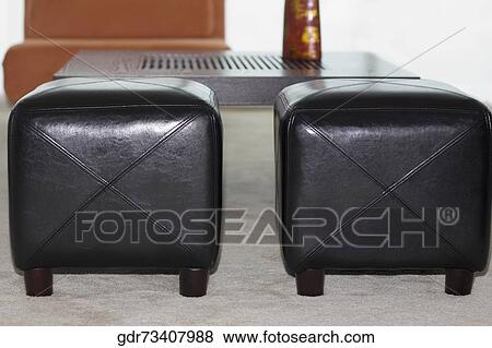Stock Photo - Ottomans in a living room. Fotosearch