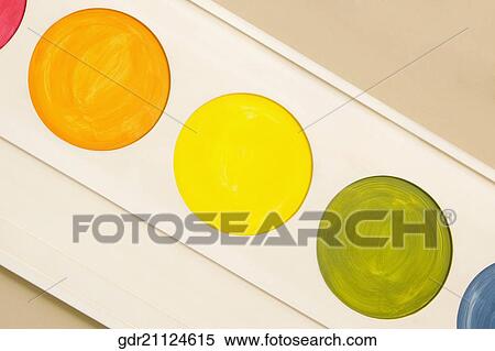 Stock Photography - Palette of watercolor paints mounted on a wall. Fotosearch
