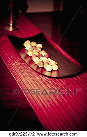 Pebbles in a tray on a table View Large Photo Image Stock Image - Pebbles in a tray on a table. Fotosearch
