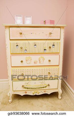 Stock Photograph - Picture frames with a box on a sideboard. Fotosearch