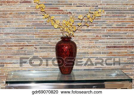 Plant vase on a table View Large Photo Image Stock Image - Plant vase on a table. Fotosearch
