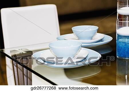 Porcelain setting on a dining table View Large Photo Image Stock Photo - Porcelain setting on a dining table. Fotosearch