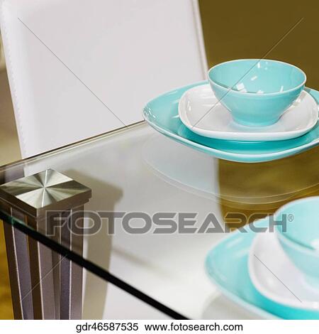 Stock Photography - Porcelain setting on a dining table. Fotosearch