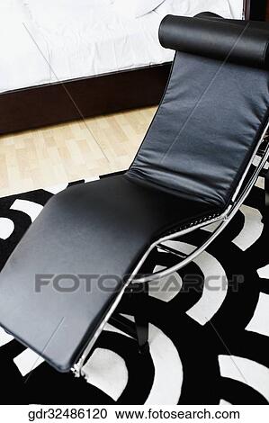 Reclining chair in the bedroom View Large Photo Image Stock Image - Reclining chair in the bedroom. Fotosearch
