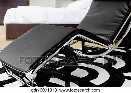 Reclining chair in the bedroom View Large Photo Image Stock Image - Reclining chair in the bedroom. Fotosearch