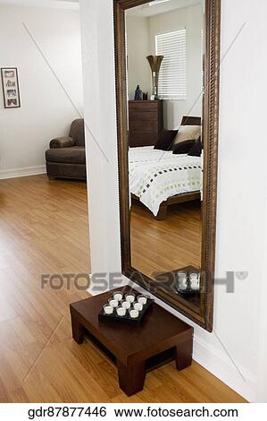 Reflection of a bed in a mirror View Large Photo Image Stock Photograph - Reflection of a bed in a mirror. Fotosearch