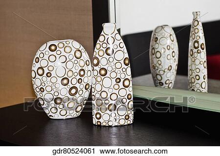 Reflection of two vases in a mirror View Large Photo Image Stock Image - Reflection of two vases in a mirror. Fotosearch