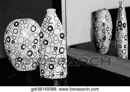 Stock Photo - Reflection of two vases in a mirror. Fotosearch