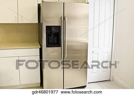 Refrigerator in the kitchen View Large Photo Image Stock Photo - Refrigerator in the kitchen. Fotosearch
