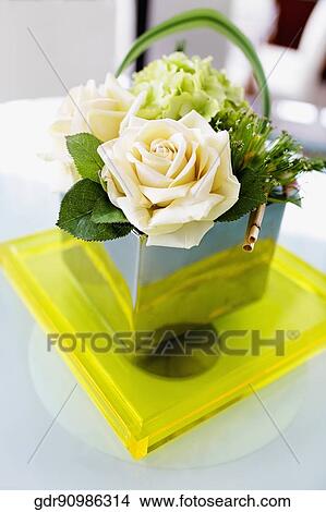 Roses in a basket on a table View Large Photo Image Picture - Roses in a basket on a table. Fotosearch