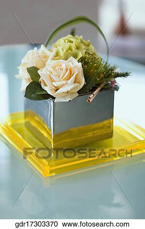 Roses in a basket on a table View Large Photo Image Stock Image - Roses in a basket on a table. Fotosearch