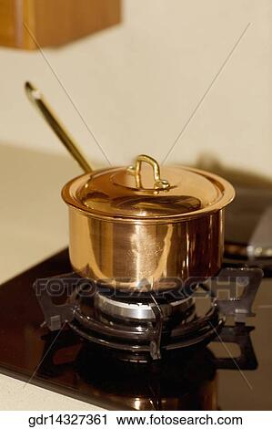 Saucepan on a stove View Large Photo Image Stock Image - Saucepan on a stove. Fotosearch