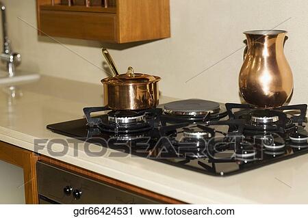 Saucepan on a stove View Large Photo Image Stock Image - Saucepan on a stove. Fotosearch