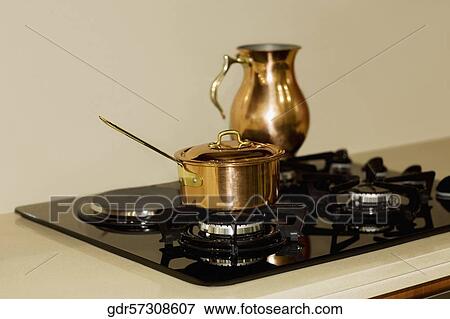 Saucepan on a stove View Large Photo Image Stock Photo - Saucepan on a stove. Fotosearch