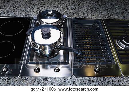 Saucepan on a stove View Large Photo Image Stock Photography - Saucepan on a stove. Fotosearch