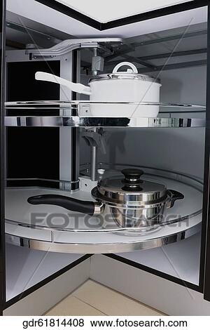 Saucepans on shelves View Large Photo Image Stock Photo - Saucepans on shelves. Fotosearch