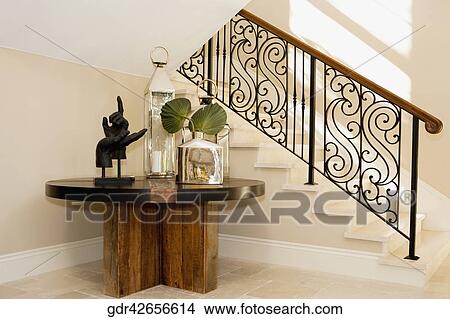 Show pieces on a table under a staircase View Large Photo Image Picture - Show pieces on a table under a staircase. Fotosearch