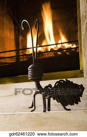 Stock Image - Showpiece near a fireplace. Fotosearch