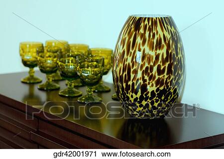 Showpiece with glasses on a sideboard View Large Photo Image Stock Image - Showpiece with glasses on a sideboard. Fotosearch