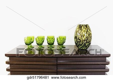 Stock Image - Showpiece with glasses on a sideboard. Fotosearch
