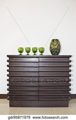 Showpiece with glasses on a sideboard View Large Photo Image Stock Photo - Showpiece with glasses on a sideboard. Fotosearch