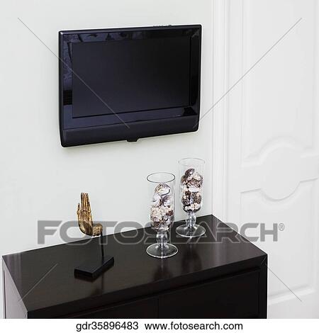 Showpieces and a television in a living room View Large Photo Image Stock Image - Showpieces and a television in a living room. Fotosearch