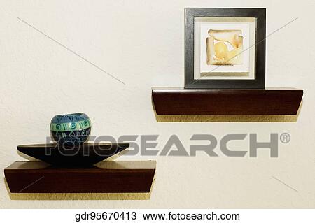 Showpieces and paintings in a living room View Large Photo Image Stock Image - Showpieces and paintings in a living room. Fotosearch