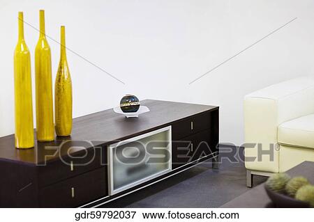 Showpieces on a drawer in a living room View Large Photo Image Stock Photo - Showpieces on a drawer in a living room. Fotosearch