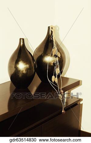 Stock Image - Showpieces on a sideboard. Fotosearch