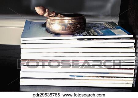 Showpieces on a stack of books View Large Photo Image Stock Photography - Showpieces on a stack of books. Fotosearch