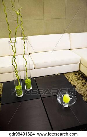 Showpieces on a table with a couch View Large Photo Image Picture - Showpieces on a table with a couch. Fotosearch