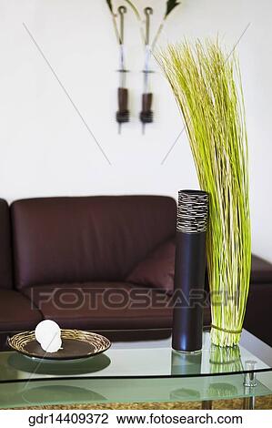 Showpieces on a table with a couch View Large Photo Image Stock Image - Showpieces on a table with a couch. Fotosearch