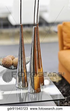 Showpieces on a table with a couch View Large Photo Image Stock Image - Showpieces on a table with a couch. Fotosearch